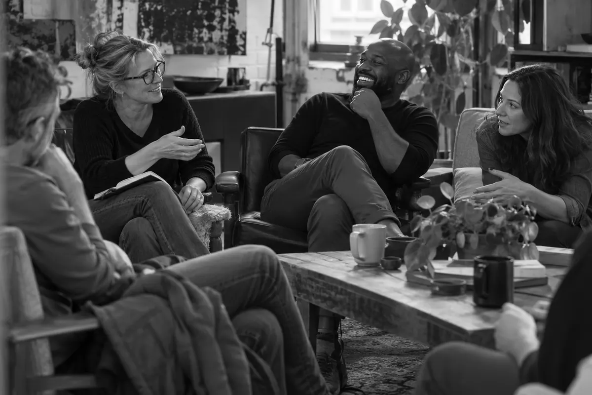 Founders and small-business owners sharing stories in a relaxed studio lounge.